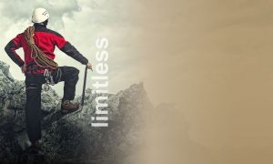 Man on a mountain in climbing gear with the overlay limitless