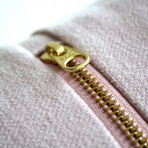 a gold zipper on a jacket