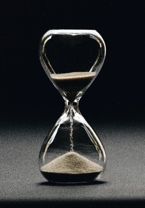 A hourglass with sand falling down between the middle.