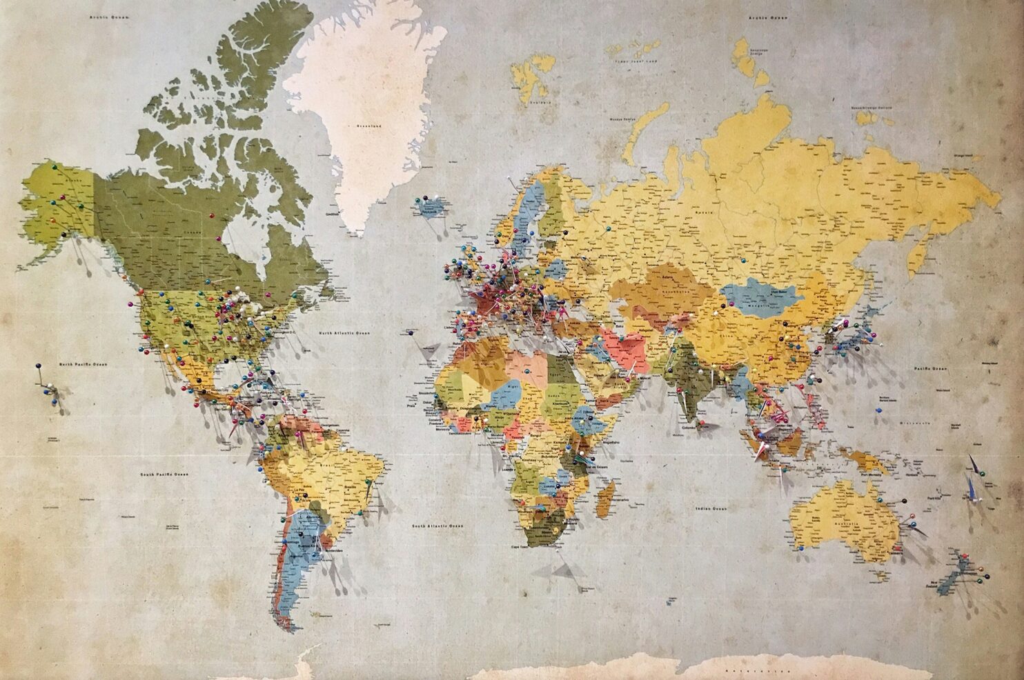 The world map with pins on different countries