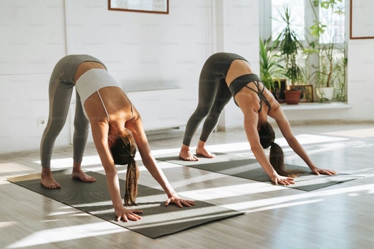 Two women doing yoga