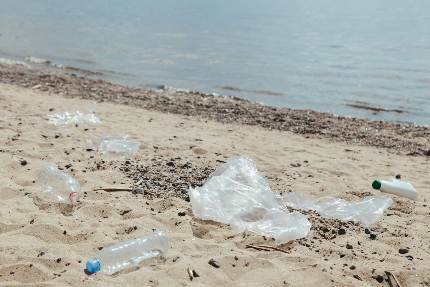 Trash on a beach by the ocean