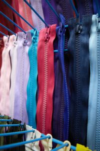 Colorful zippers of white, pink, red, blue and navy